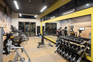 weights and machines in a fitness center.